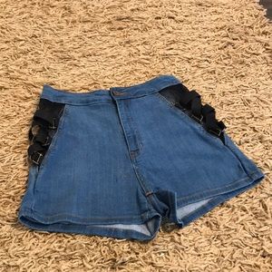 High waist denim shorts with fish net and buckles on the side